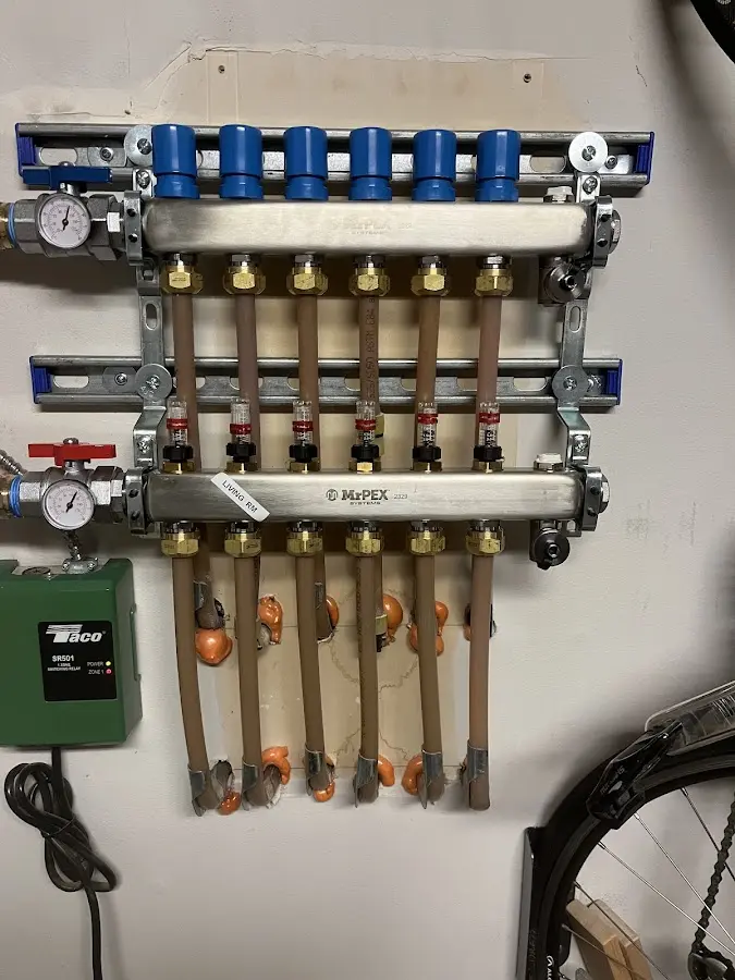 Plumber performing Water Heater Repair at a residential property in Elyria